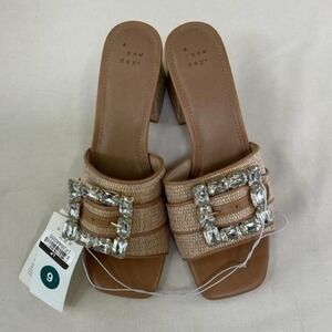 A New Day mule heels featuring a stunning oversized rhinestone buckle